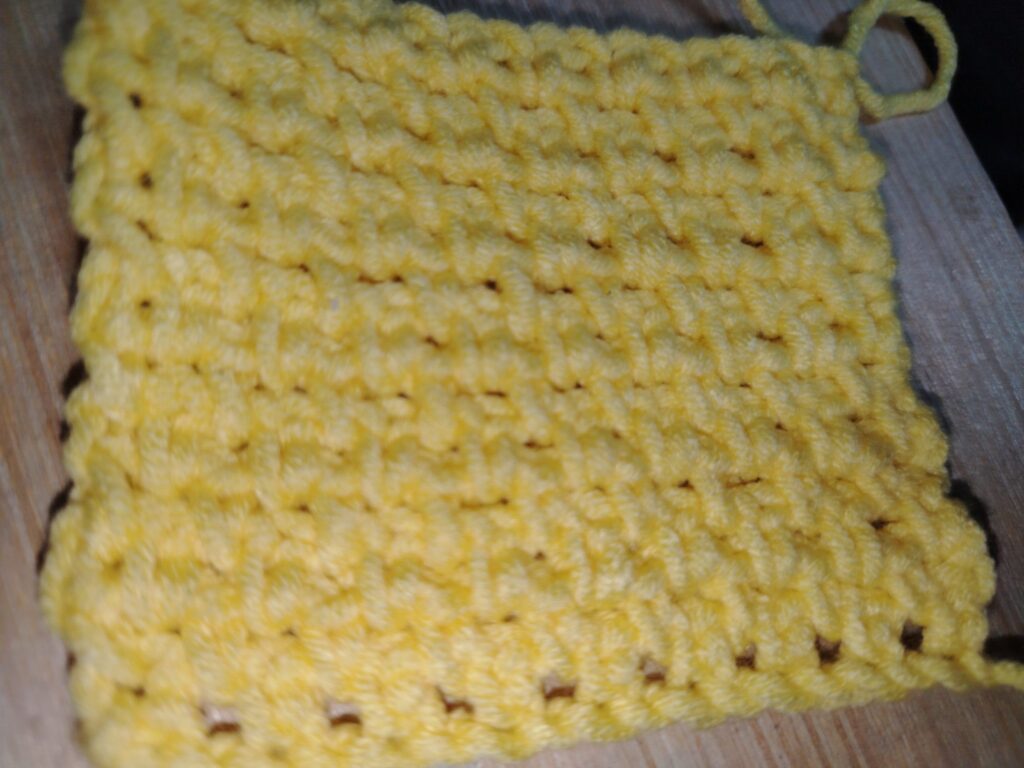 Crochet linen stitch swatch showing a neat woven texture
